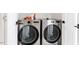 Laundry room features modern, stainless steel, front-loading washer and dryer at 1112 Watauga Street St, Raleigh, NC 27604