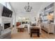Bright living room with vaulted ceilings, a fireplace, and stylish decor at 1112 Watauga Street St, Raleigh, NC 27604