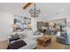 Open-concept living room with fireplace, hardwood floors, and abundant natural light at 1112 Watauga Street St, Raleigh, NC 27604