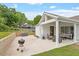 An inviting outdoor living space with stylish seating, a grill, and a well-maintained concrete patio at 1112 Watauga Street St, Raleigh, NC 27604