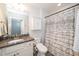 Bathroom with a single sink vanity, granite countertop, and a shower-tub combination with a decorative curtain at 112 Manning Way, Durham, NC 27703