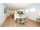 Charming dining area adjacent to the kitchen, featuring wood floors and ample natural light for a welcoming ambiance at 112 Manning Way, Durham, NC 27703