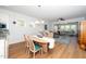 Open-concept dining area with wood floors, neutral decor, and ample natural light, creating an inviting atmosphere at 112 Manning Way, Durham, NC 27703