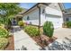Well-maintained home showcasing manicured landscaping, a charming walkway, and an inviting entrance at 112 Manning Way, Durham, NC 27703