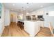 Spacious kitchen with a large island, granite countertops, stainless steel appliances, and plenty of cabinet space at 112 Manning Way, Durham, NC 27703