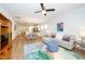 Open-concept living area seamlessly integrates with dining and kitchen, featuring modern decor, and wood flooring at 112 Manning Way, Durham, NC 27703