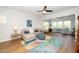 Cozy living room with ceiling fan, plush seating, and stylish rug, perfect for relaxation and entertaining guests at 112 Manning Way, Durham, NC 27703
