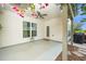 Inviting covered patio featuring a ceiling fan, creating a comfortable outdoor living space with serene backyard views at 112 Manning Way, Durham, NC 27703