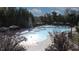 Community pool with a fireplace, canopies, and ample seating for relaxation and enjoyment at 112 Manning Way, Durham, NC 27703