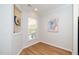 Bright room featuring wood-look floors, neutral walls, artwork, and a window offering ample natural light at 112 Manning Way, Durham, NC 27703