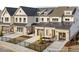 Beautiful two-story townhomes with metal roof accents, brick, fenced yards, and individual one car garage at 115 N District Ave # 298, Clayton, NC 27527