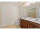 Bathroom with a double sink vanity and glass-enclosed shower at 1175 Contessa Dr, Cary, NC 27513