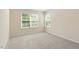 Bedroom with plush carpet and natural light from windows at 1175 Contessa Dr, Cary, NC 27513
