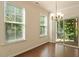 Bright dining area with hardwood floors and sliding glass doors leading to a patio at 1175 Contessa Dr, Cary, NC 27513