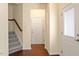 Spacious entryway featuring a staircase, neutral paint and hardwood floors at 1175 Contessa Dr, Cary, NC 27513