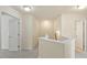 Bright hallway featuring neutral tones and white trim, leading to various rooms at 1175 Contessa Dr, Cary, NC 27513