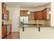 The kitchen features stainless steel appliances, granite counters, and a breakfast bar at 1175 Contessa Dr, Cary, NC 27513