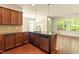 Updated kitchen featuring stainless steel appliances, a breakfast bar, and ample cabinet space at 1175 Contessa Dr, Cary, NC 27513