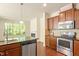 The kitchen flows to the living room, offering stainless steel appliances and great natural light at 1175 Contessa Dr, Cary, NC 27513