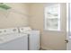 Functional laundry room equipped with a washer and dryer at 1175 Contessa Dr, Cary, NC 27513