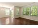 Living room with large windows and sliding glass doors that fill the space with natural light at 1175 Contessa Dr, Cary, NC 27513