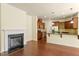 Open-concept living room next to kitchen boasts a fireplace and great natural light at 1175 Contessa Dr, Cary, NC 27513