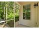 Spacious screened porch with a view of a lush green backyard at 1175 Contessa Dr, Cary, NC 27513