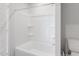A clean, bright bathroom featuring a white shower and tub combo at 124 Landon Pl, Roxboro, NC 27573