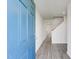 Inviting entryway featuring a blue front door and modern gray wood-look flooring at 124 Landon Pl, Roxboro, NC 27573