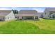 Large backyard with a covered patio and ample space for outdoor activities at 1306 Cricket St, Elon, NC 27244