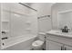 New bathroom featuring black hardware, soaking tub and bright white surfaces at 1306 Cricket St, Elon, NC 27244
