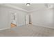 Bedroom featuring plush carpet, tray ceiling and an ensuite bathroom and dual closets at 1306 Cricket St, Elon, NC 27244