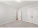 Bright bedroom features neutral carpeting and white trim and doors throughout at 1306 Cricket St, Elon, NC 27244