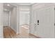 Bright foyer with wood floors and views into a room with wainscoting at 1306 Cricket St, Elon, NC 27244