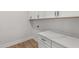 Mudroom area featuring storage cabinets and countertop space at 1306 Cricket St, Elon, NC 27244