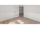Office with wood floor and view of an open door to another room at 1306 Cricket St, Elon, NC 27244