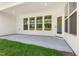 Covered patio with concrete floor and ample natural light and view of the backyard at 1306 Cricket St, Elon, NC 27244