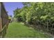 Spacious backyard with lush green lawn and a privacy fence at 133 Pasadena Rd, Garner, NC 27529