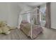 Charming bedroom with a canopy bed, neutral color scheme, and plush carpeting at 133 Pasadena Rd, Garner, NC 27529
