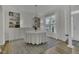 Bright dining room with natural light and a table set for an elegant meal at 133 Pasadena Rd, Garner, NC 27529