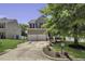 Traditional two-story home featuring an attached two-car garage, complemented by a well-maintained lawn and driveway at 133 Pasadena Rd, Garner, NC 27529