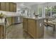 Open kitchen featuring granite countertops, stainless steel appliances, and an island with seating at 133 Pasadena Rd, Garner, NC 27529