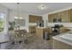 Open kitchen featuring granite countertops, stainless steel appliances, and an island with seating at 133 Pasadena Rd, Garner, NC 27529