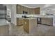 Open kitchen featuring granite countertops, stainless steel appliances, and an island with seating at 133 Pasadena Rd, Garner, NC 27529