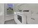 Bright laundry room with a washer, dryer, and utility sink at 133 Pasadena Rd, Garner, NC 27529