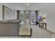 Comfortable living room with a plush gray sectional sofa, a desk, and natural light at 133 Pasadena Rd, Garner, NC 27529