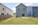 Home's back exterior features durable siding, windows, and a sliding glass door at 138 Yellow Jacket Rdg, Clayton, NC 27520