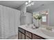 Bathroom with double vanity, a shower, and stylish decor, providing a functional design at 138 Yellow Jacket Rdg, Clayton, NC 27520