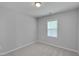 Bright bedroom with neutral carpet and large window offering natural light at 138 Yellow Jacket Rdg, Clayton, NC 27520