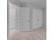 Carpeted bedroom with white doors and trim, offering ample closet space at 138 Yellow Jacket Rdg, Clayton, NC 27520